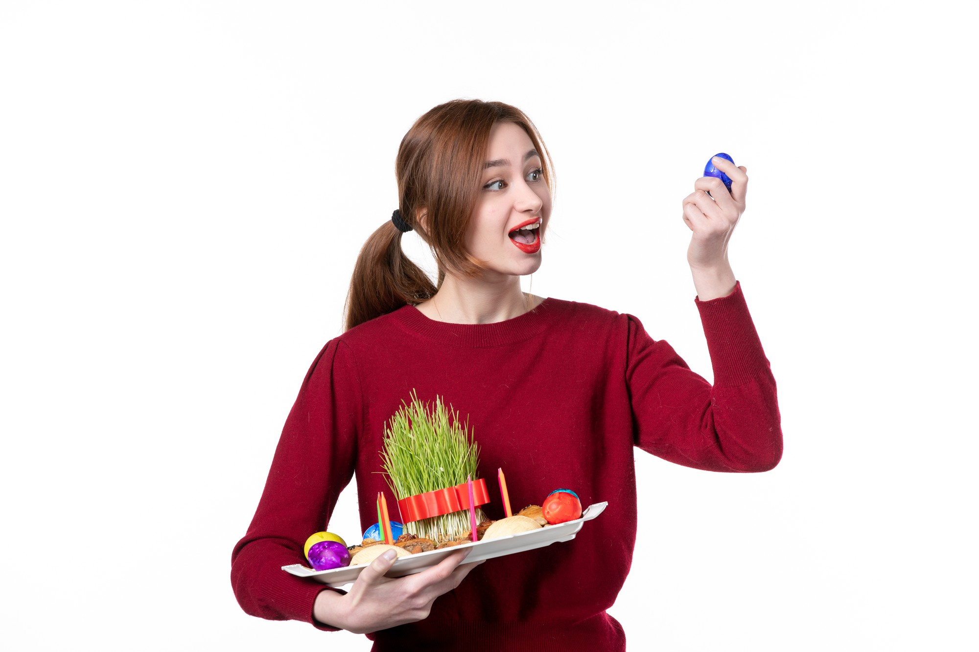 Student plating a colorful salad